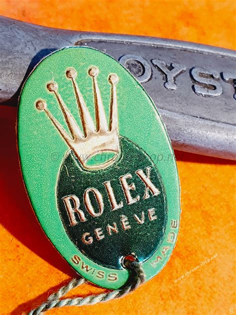 green hang tag rolex.